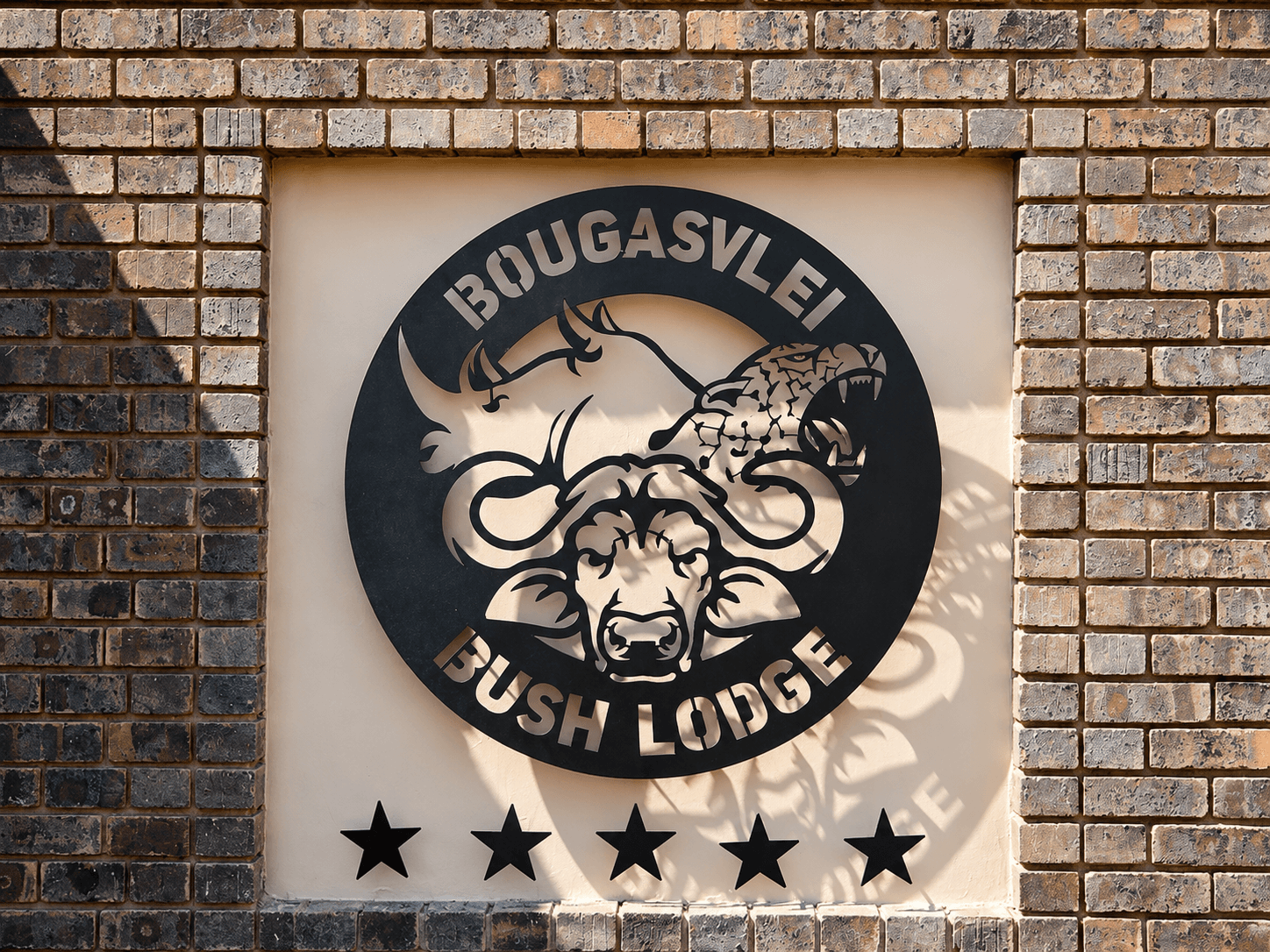 Bushveld entrance road and gate to the Bougasvlei Safaris game farm