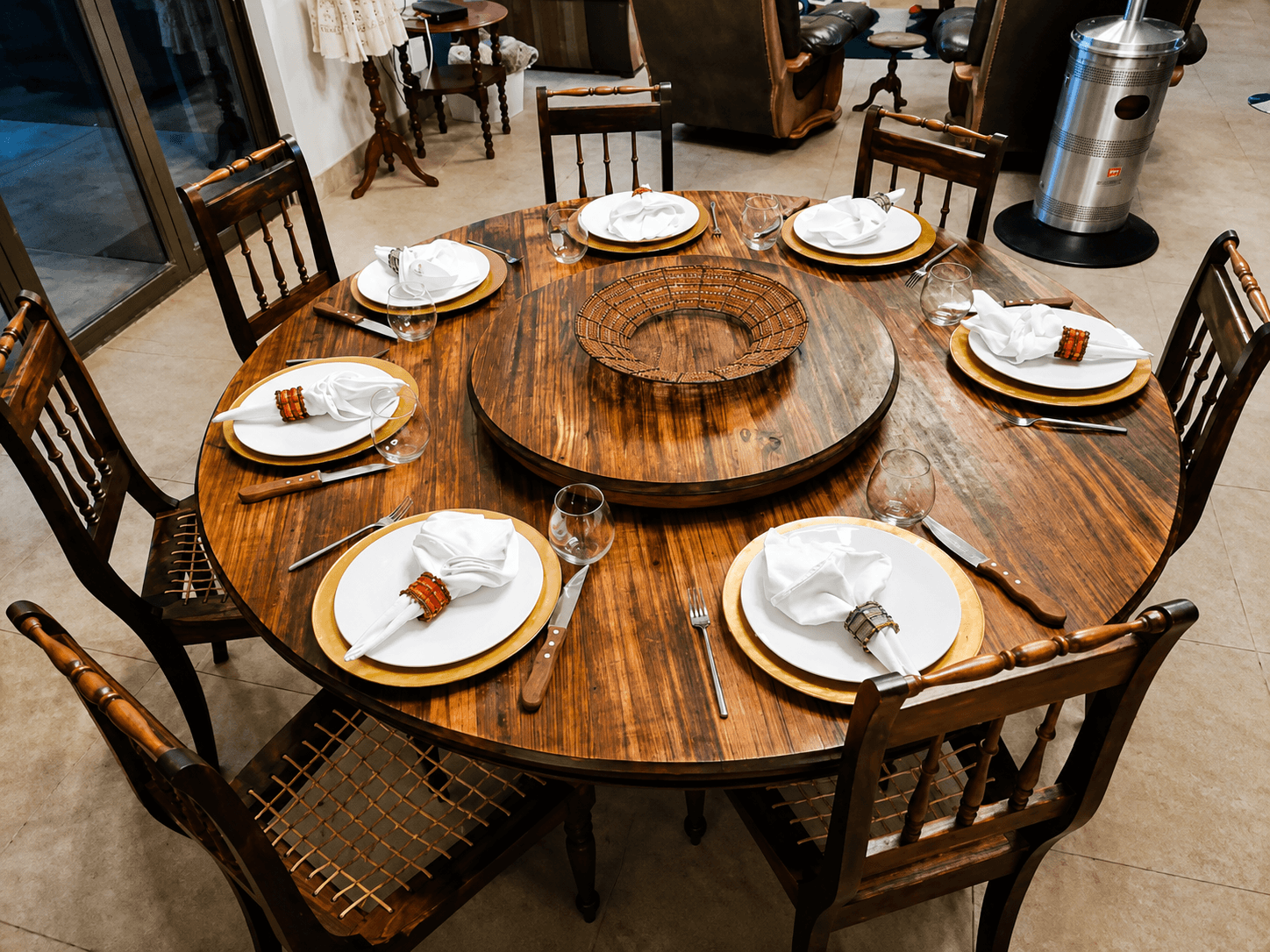 Dining table set for guests inside the Bougasvlei Safaris lodge